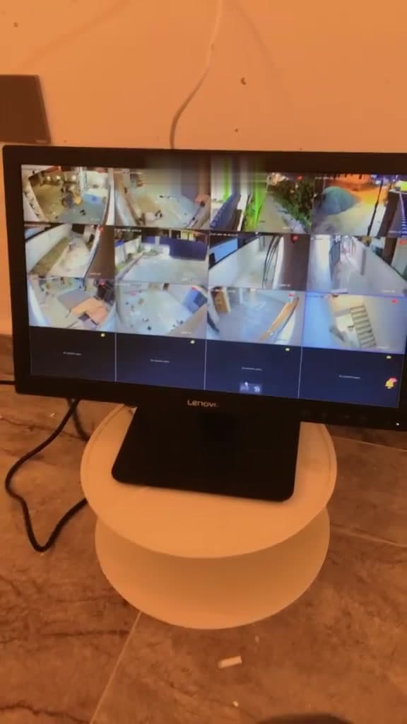 Desktop monitor showing a multi-channel live CCTV view after the system was commissioned