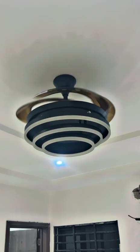 Modern ceiling fan with a tiered LED ring light installed and running